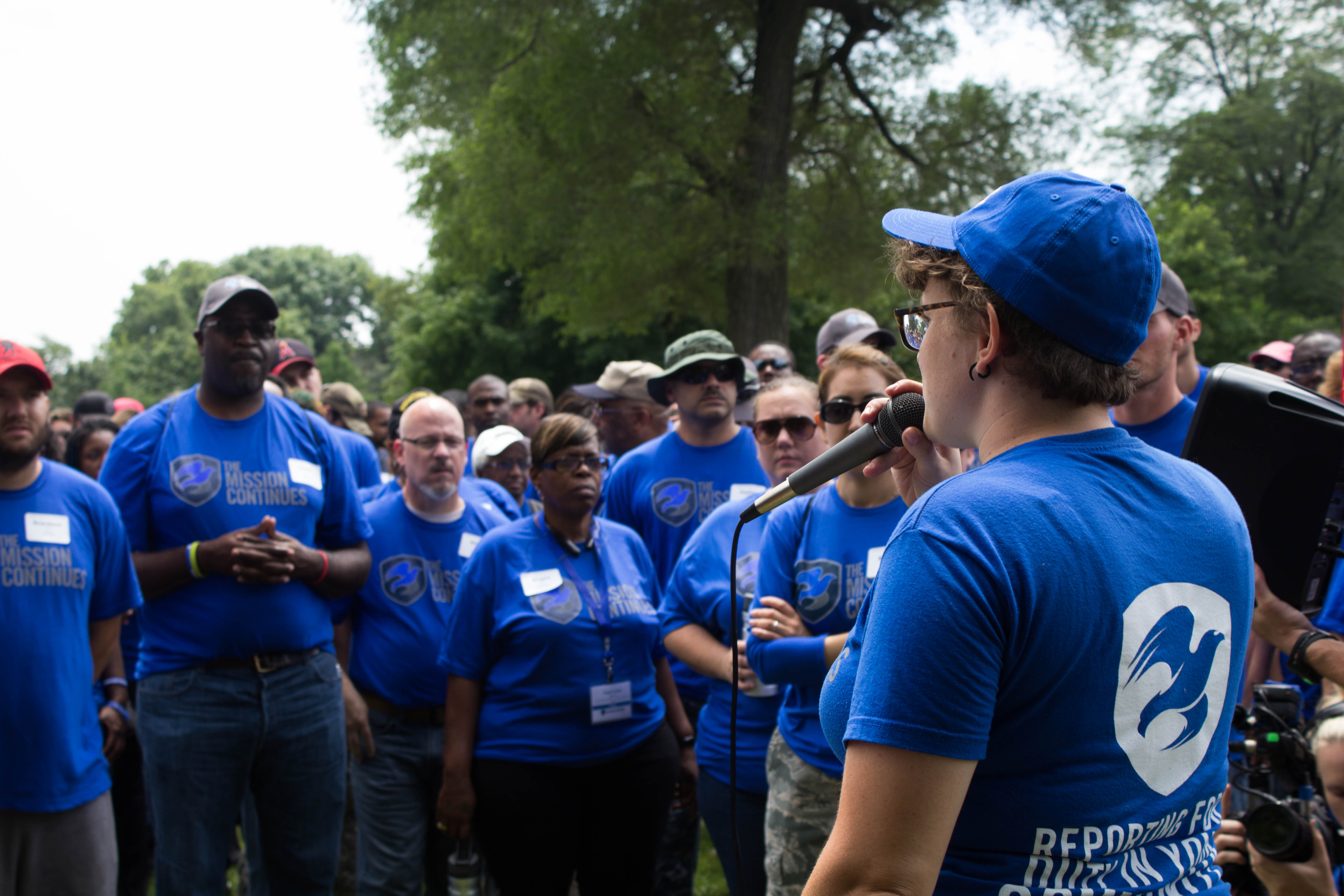 Jessica addresses volunteers at a service project, July 2015.