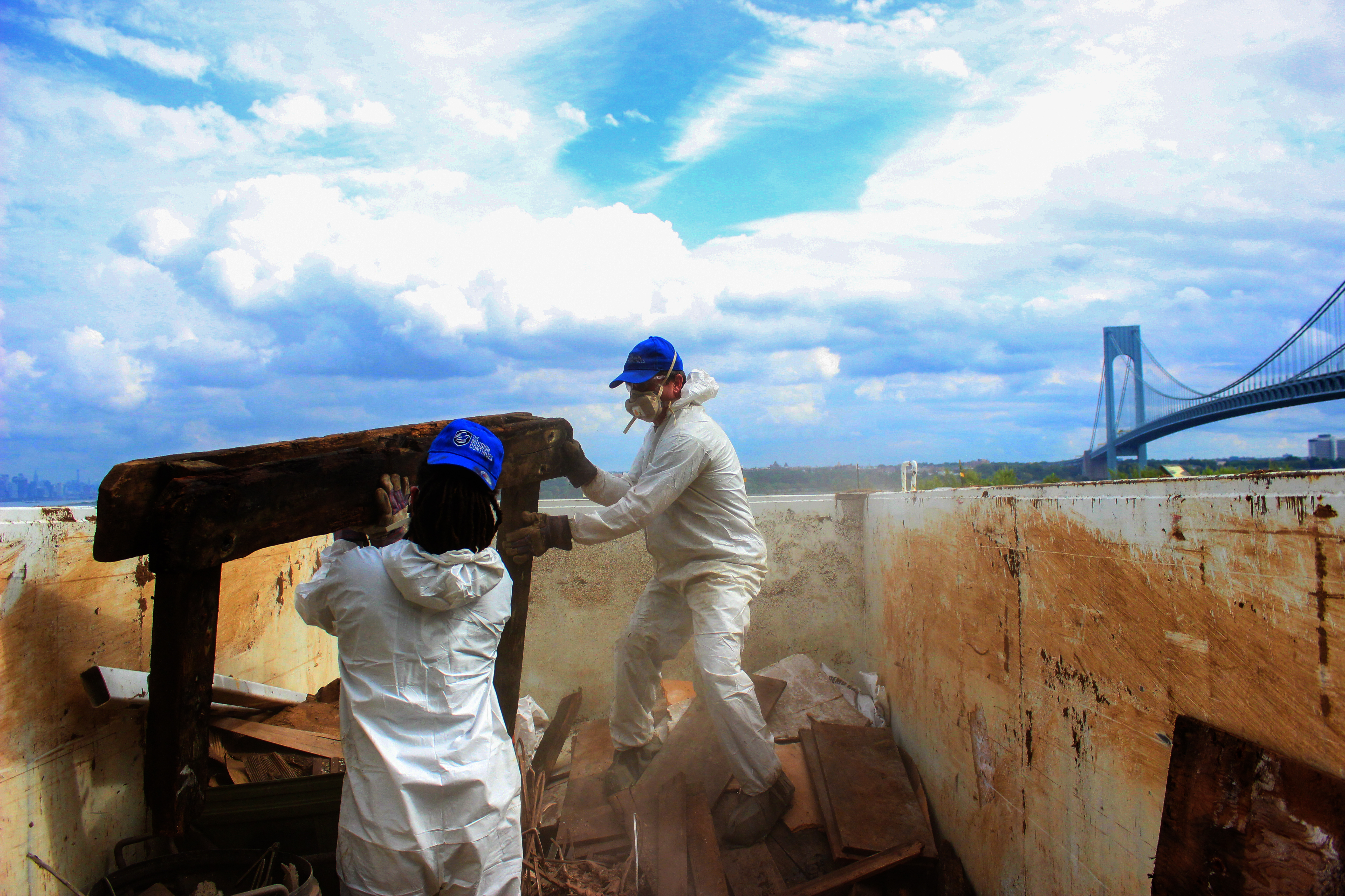 Platoon members filling dumpsters with debris from Ft. Wadsworth, September 12, 2015.