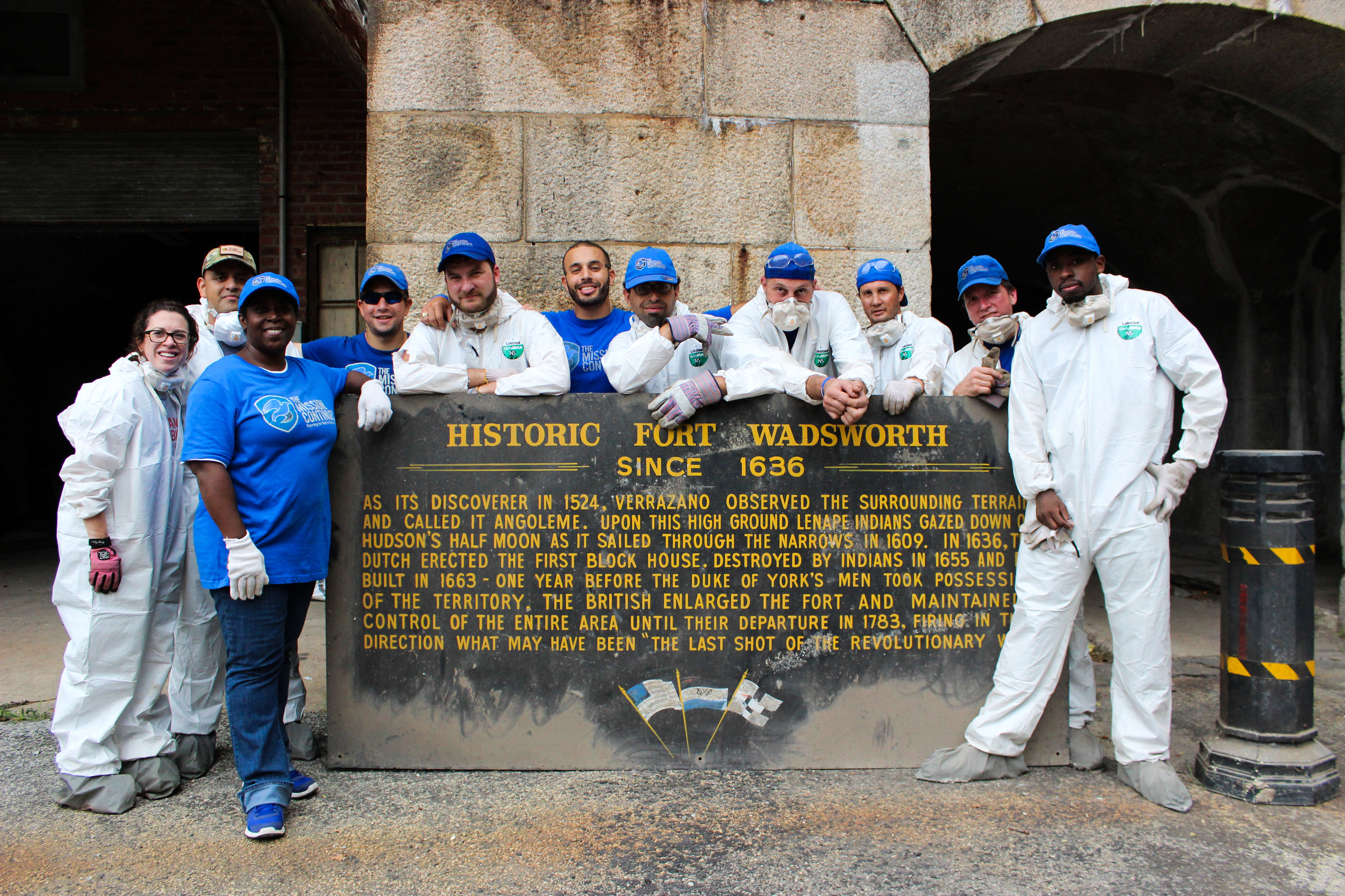 New York platoon members pose with a historic sign uncovered at Ft. Wadsworth, September 12, 2015.