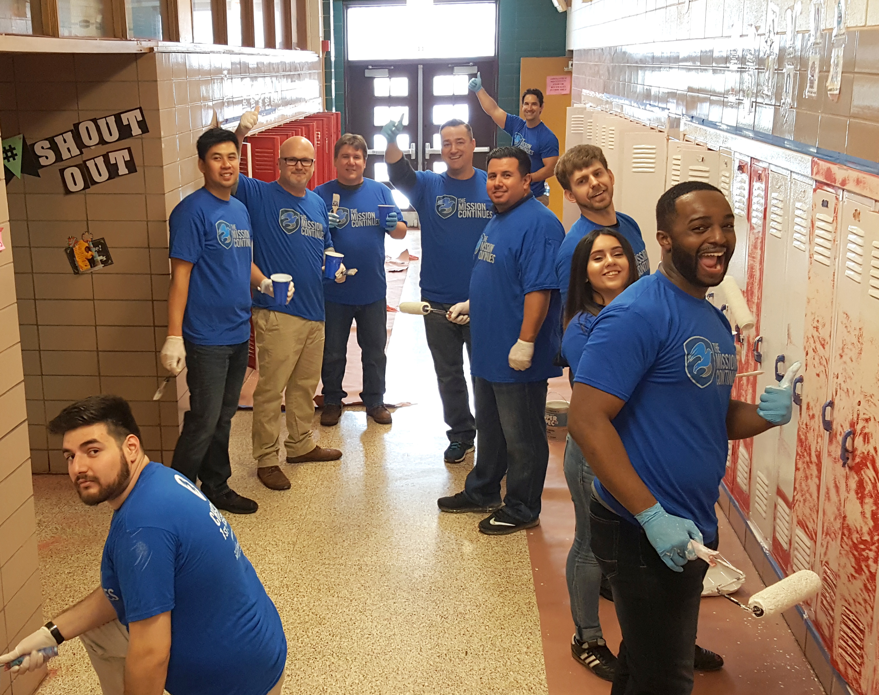 A group of platoon members paint a school hallway in Chicago.