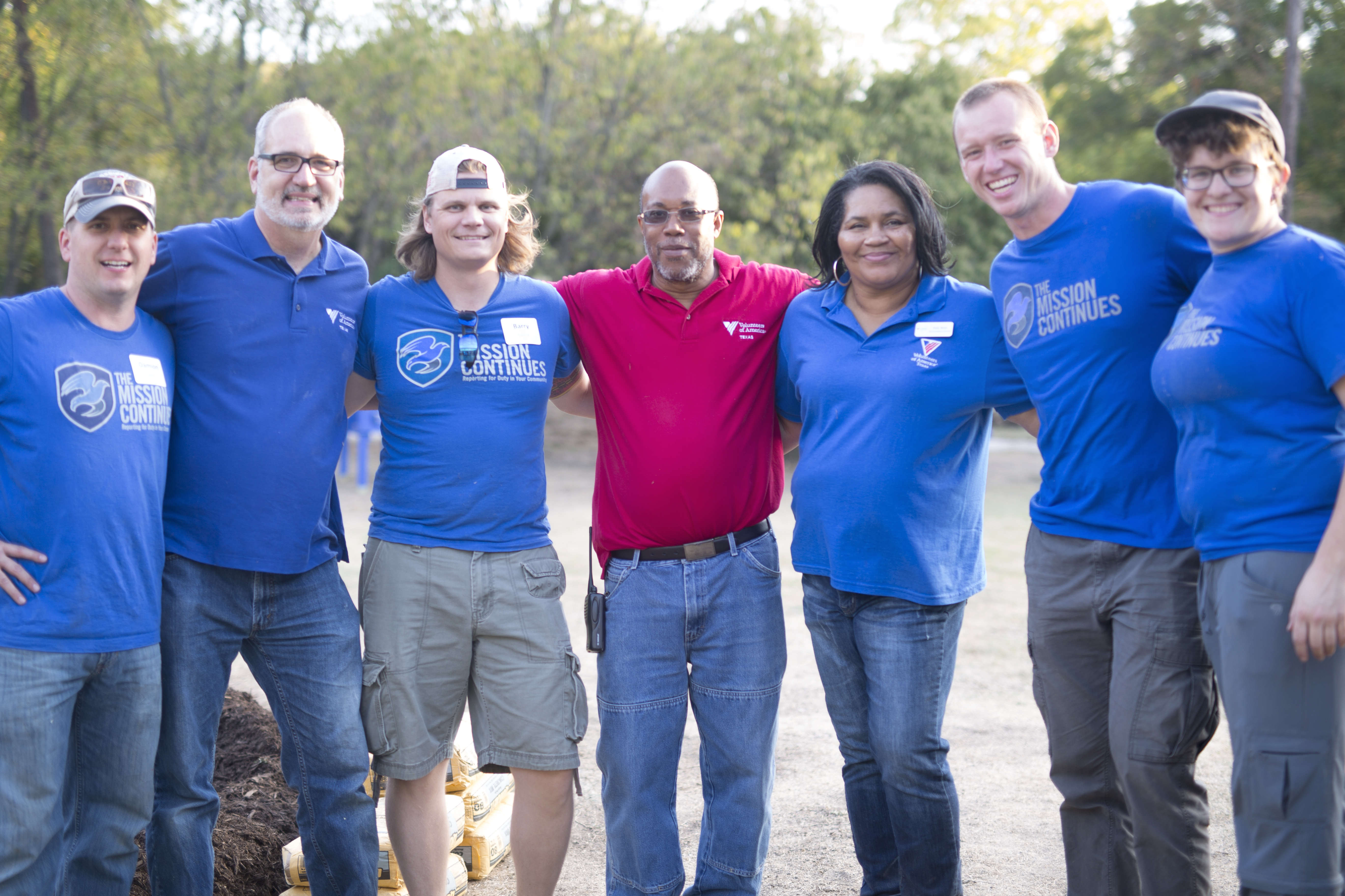 Members of The Mission Continues and staffers at Avenue J come together during the service project.