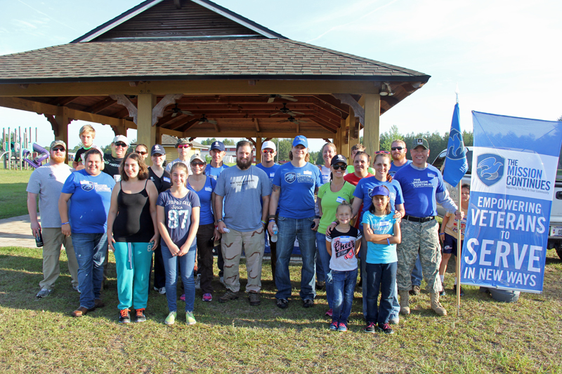 Jacksonville 1st Service Platoon gathers with WWP volunteers after the project.
